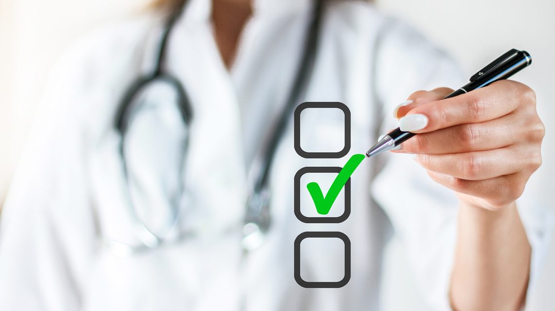 Provider in the background checking boxes on a clear screen